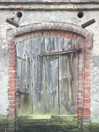 Old weathered door on wall