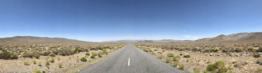 Road amidst landscape against clear sky