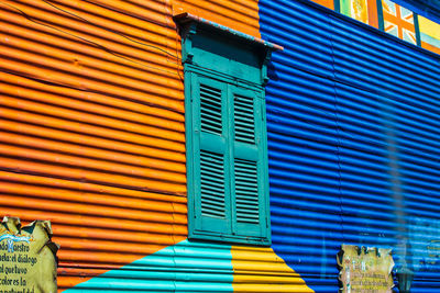 Low angle view of multi colored windows on building