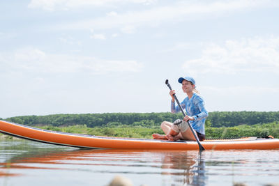 Portrait of man surfing in boat