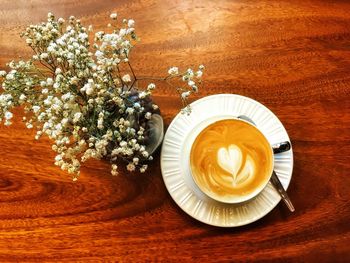 Directly above shot of cappuccino served on table