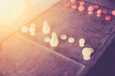 High angle view of lit candles on table