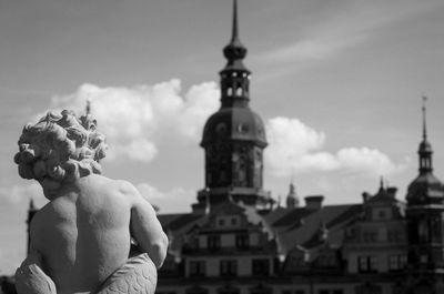 Statue of historic building against sky