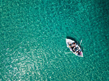 High angle view of man on boat in sea