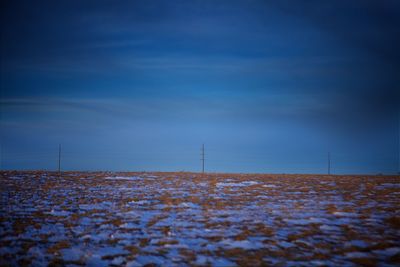 Scenic view of landscape against blue sky