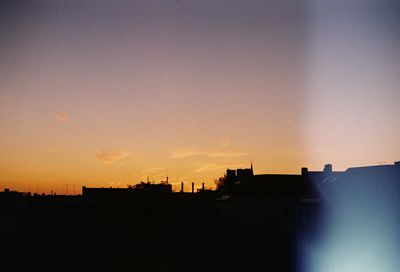 Silhouette of city at sunset