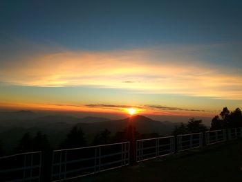 Scenic view of silhouette mountains against sky during sunset