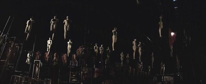 Low angle view of mannequins hanging at theater