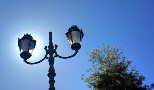 Street journals- low angle view of street light against sky