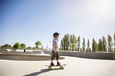Side view of boy skateboarding on ramp