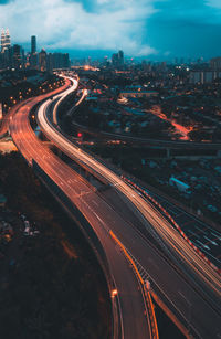 High angle view of light trails on road in city