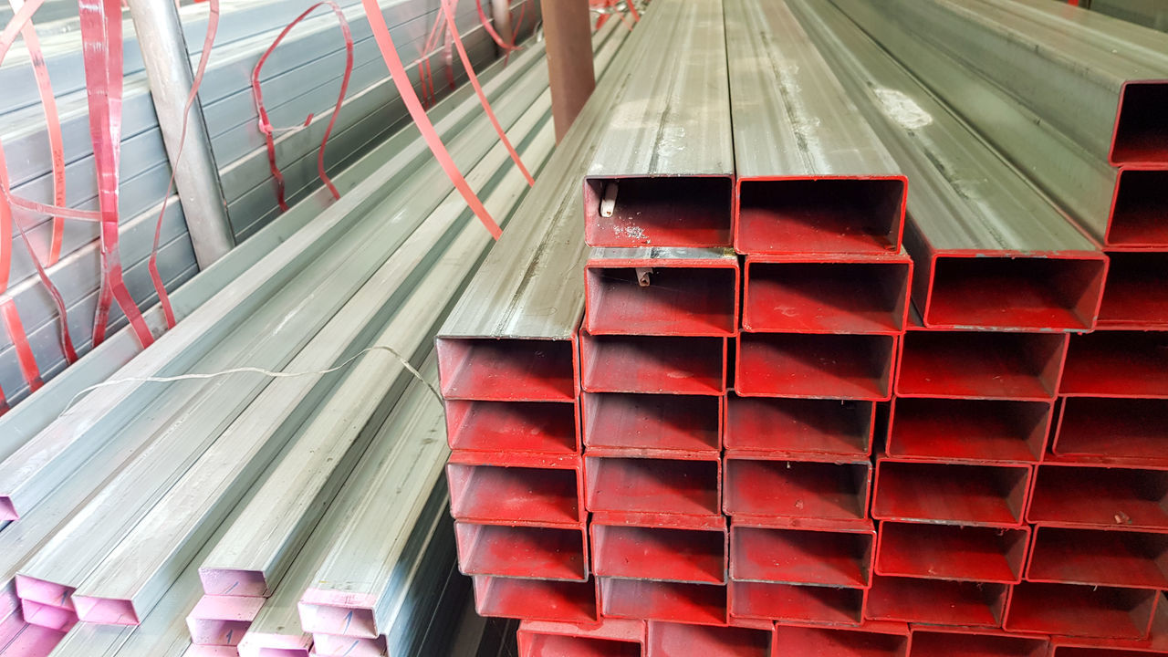 LOW ANGLE VIEW OF RED STACK OF METAL