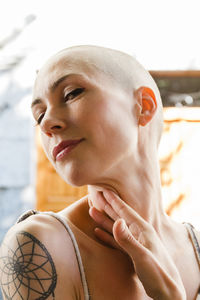 Young woman with shaved head