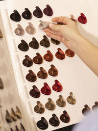 Cropped hand of person holding dices