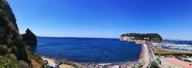 Panoramic view of sea against blue sky