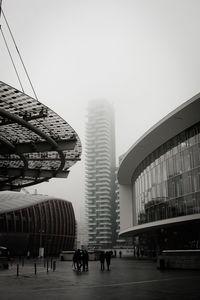 Buildings in city against clear sky