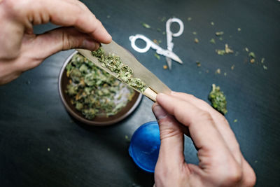 High angle view of person preparing food on table