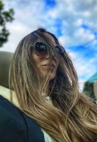 Portrait of woman against sky