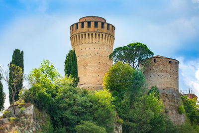 Low angle view of old ruins against sky