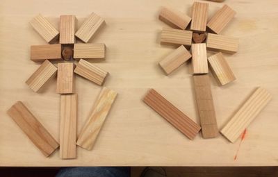 High angle view of wooden blocks arranging on table