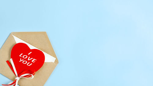 Directly above shot of heart shapes on blue background