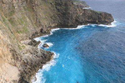 High angle view of cliff by sea