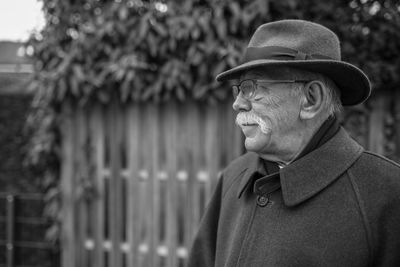 Portrait of man wearing hat standing outdoors