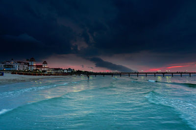 Scenic view of sea against sky at dusk