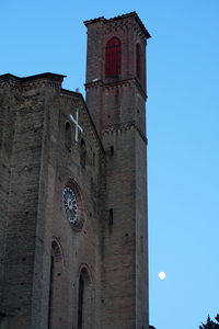 Low angle view of historic building against clear blue sky