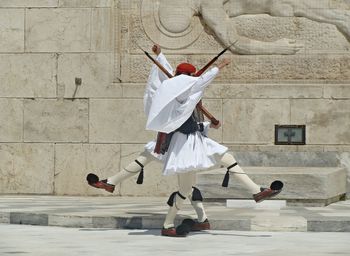 Full length of young woman jumping