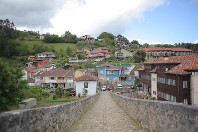 Houses in town against sky