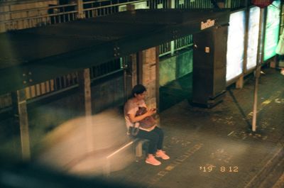 Full length of man playing in bus