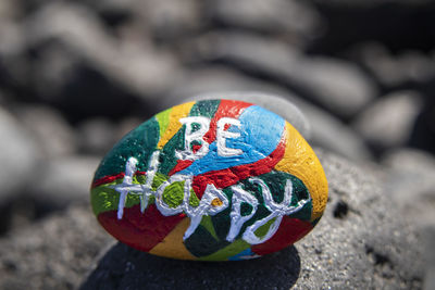 Close-up of multi colored ball on rock