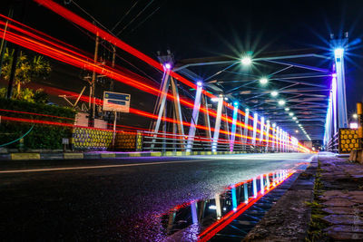 Light trails on street in city at night