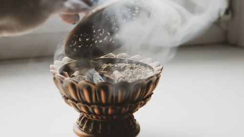 Close-up of seashell on glass table