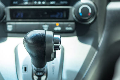 Close-up of gearshift in car