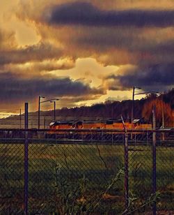 Scenic view of landscape against dramatic sky