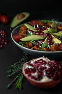 Close-up of fresh fruits in bowl on table