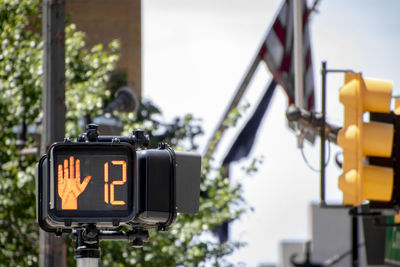 Close-up of road sign on street