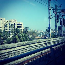 Railroad tracks against blue sky