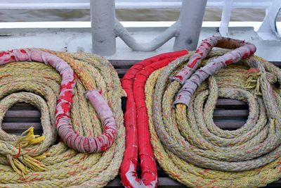 High angle view of rope tied to railing
