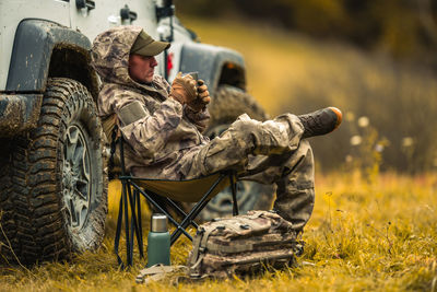 Side view of man working on field