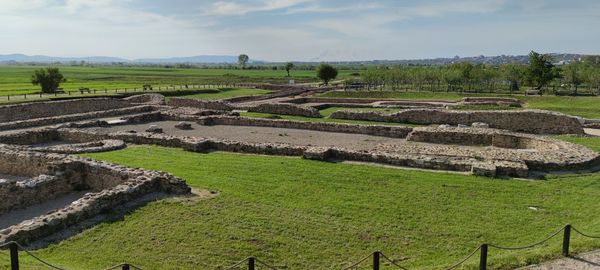 Scenic view of farm against sky