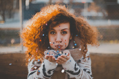 Portrait of girl holding outdoors