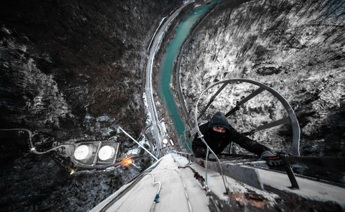 Man in car on road during winter