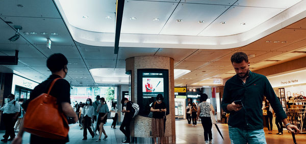 Group of people walking in airport