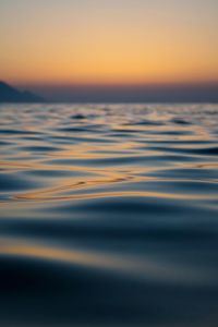 Scenic view of sea against sky at sunset