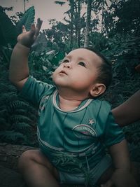 Portrait of cute baby girl looking up