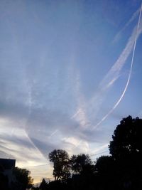 Low angle view of vapor trails in sky