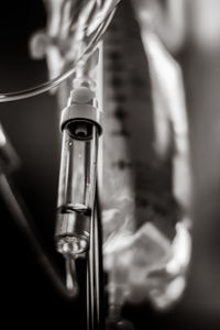 Low angle view of lighting equipment hanging on metal